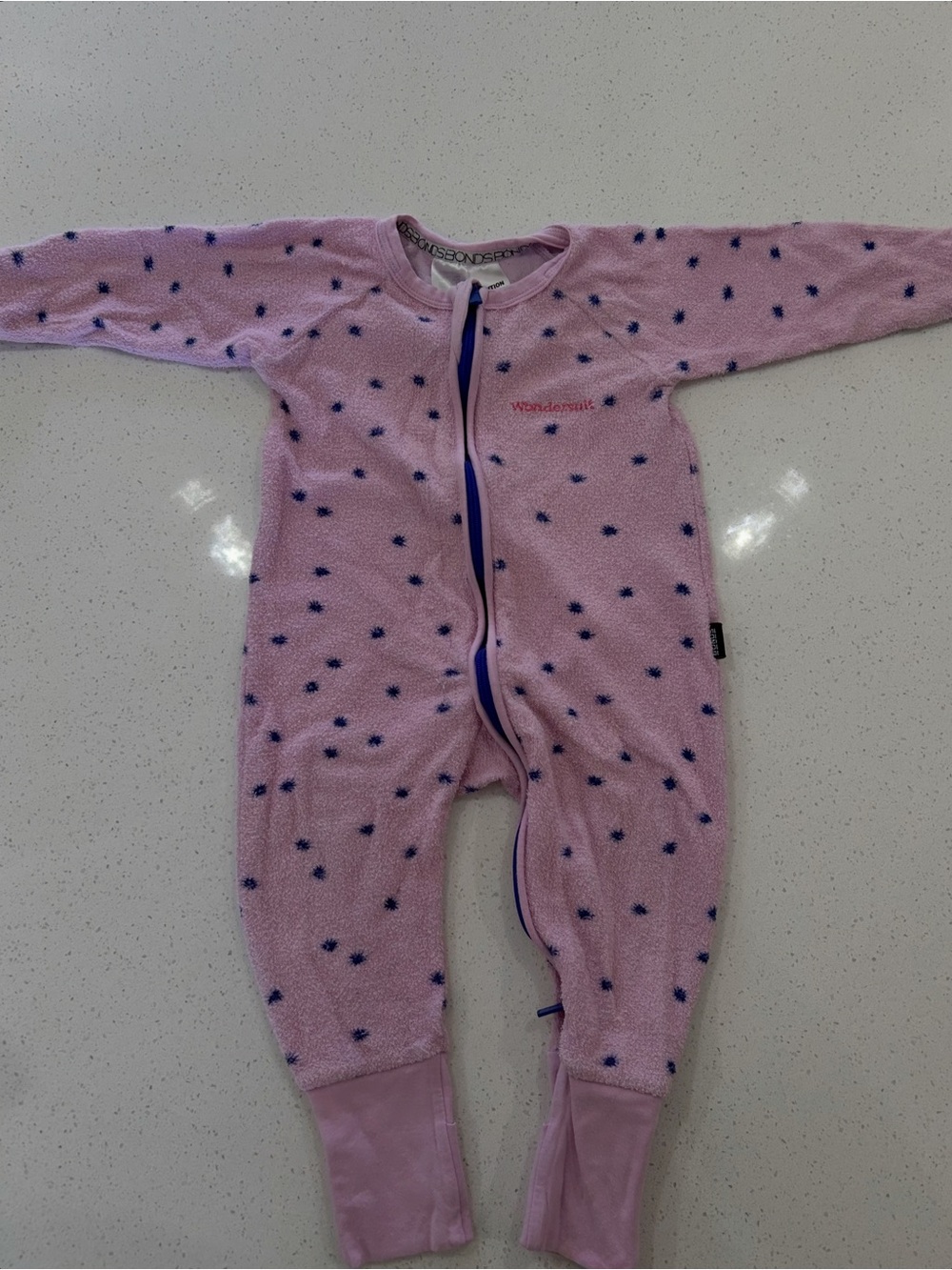 BONDS Wondersuit purple terry cloth material with indigo dots